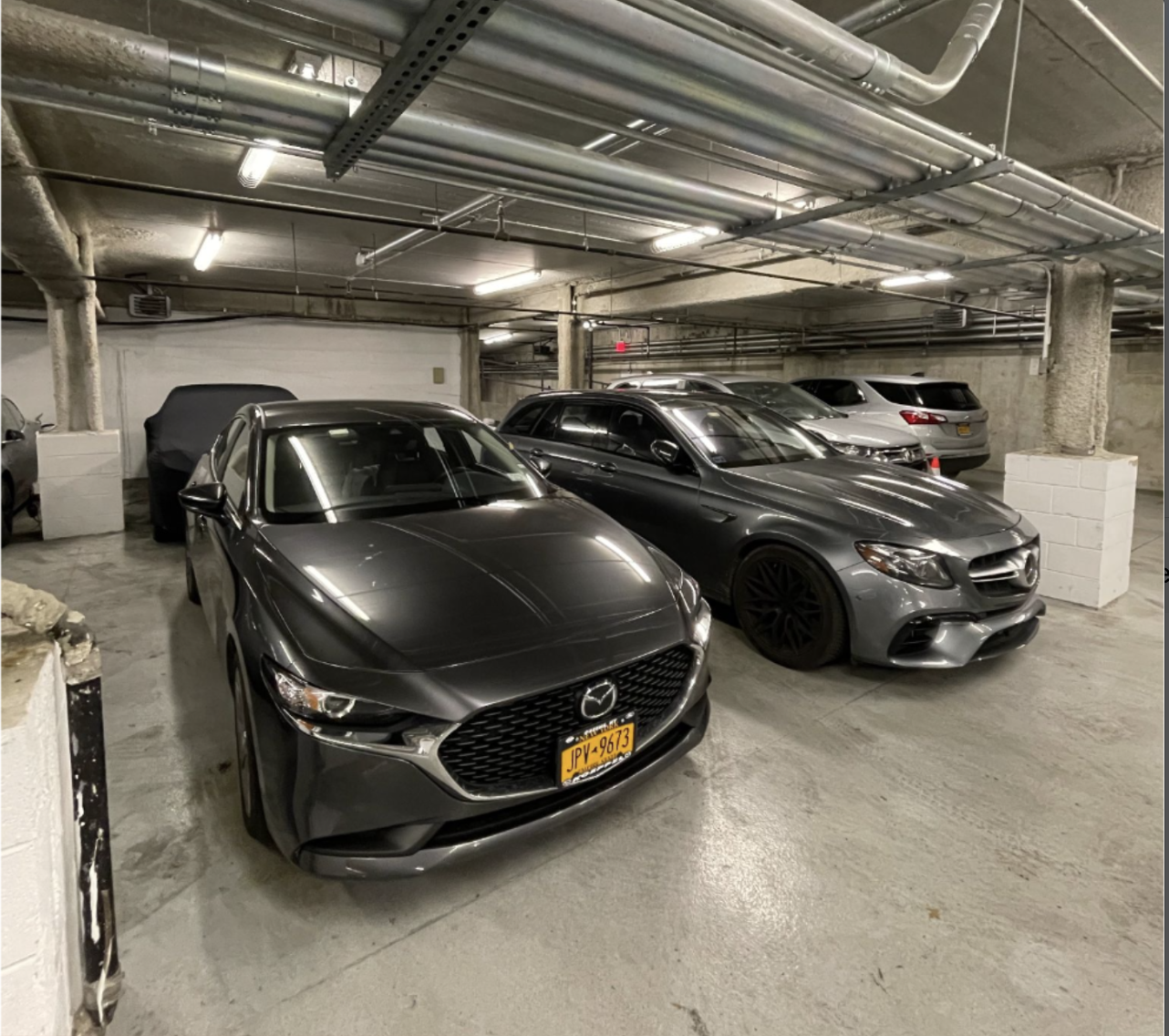 Underused parking garage with parked vehicles